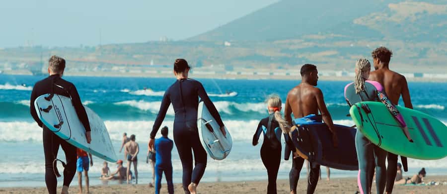 Agadir: 2h Surf Lesson with Local Instructors - Moving into the water and catching your first wave