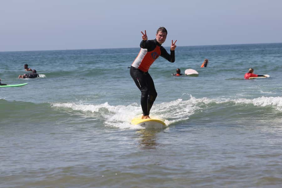 Agadir: Taghazout Beach Surf Lesson with Lunch and Transfer - Getting fitted at the surf shop
