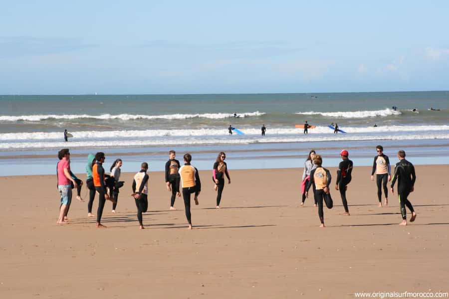 Agadir: Taghazout Beach Surf Lesson with Lunch and Transfer - The first session: theory, warm-up, and sand practice