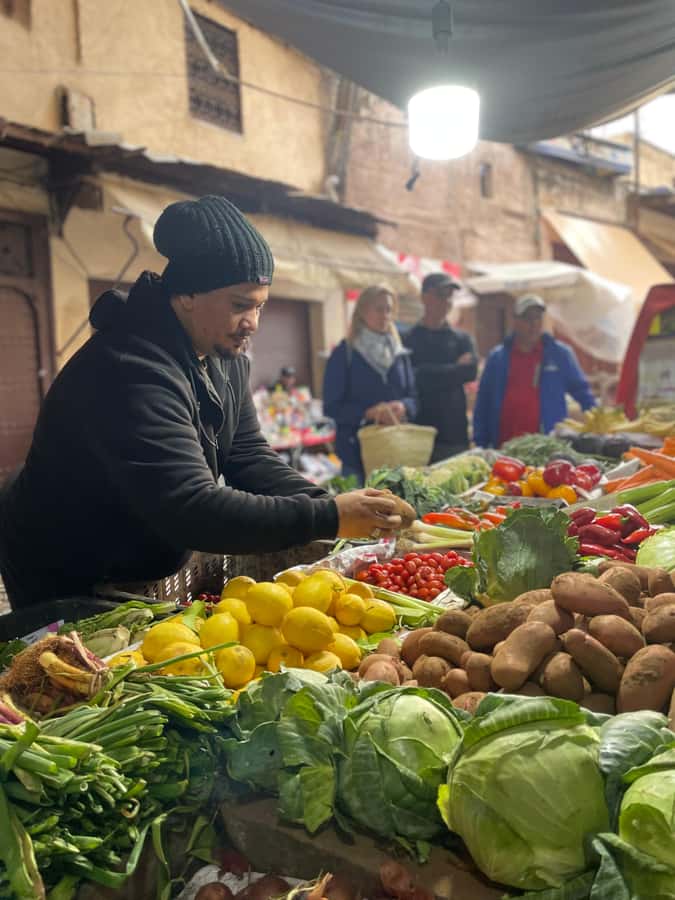 Fez: Souk Tour and Traditional Home Cooking Class - Sitting down to eat in a Moroccan home
