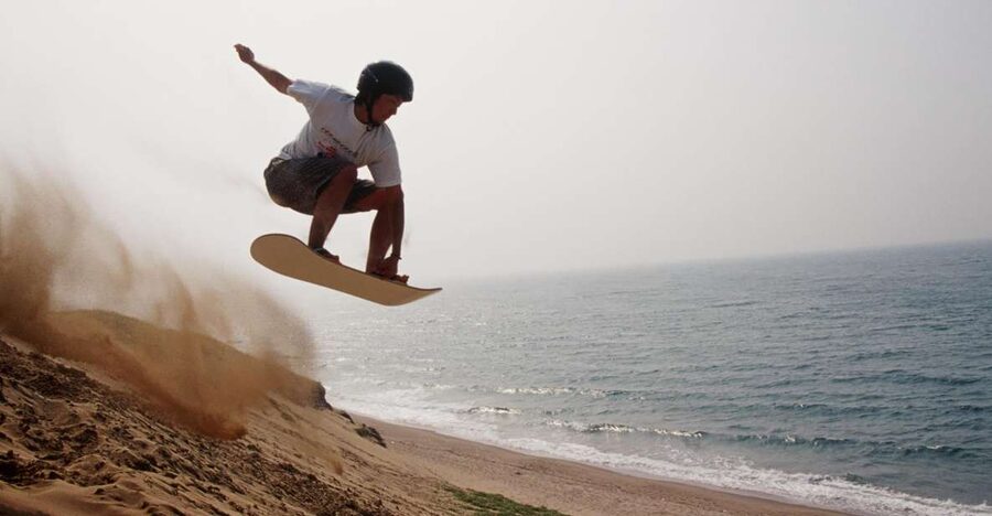 From Agadir or Taghazout: Desert Sand Boarding Tour w/ Lunch - The coastal road through Aourir, Taghazout, and Tamri