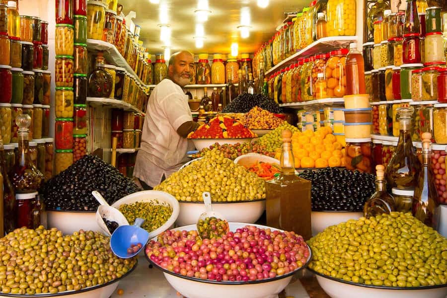 From Casablanca: Marrakech Guided Day Trip with Camel Ride - Walking the Medina and entering the souks