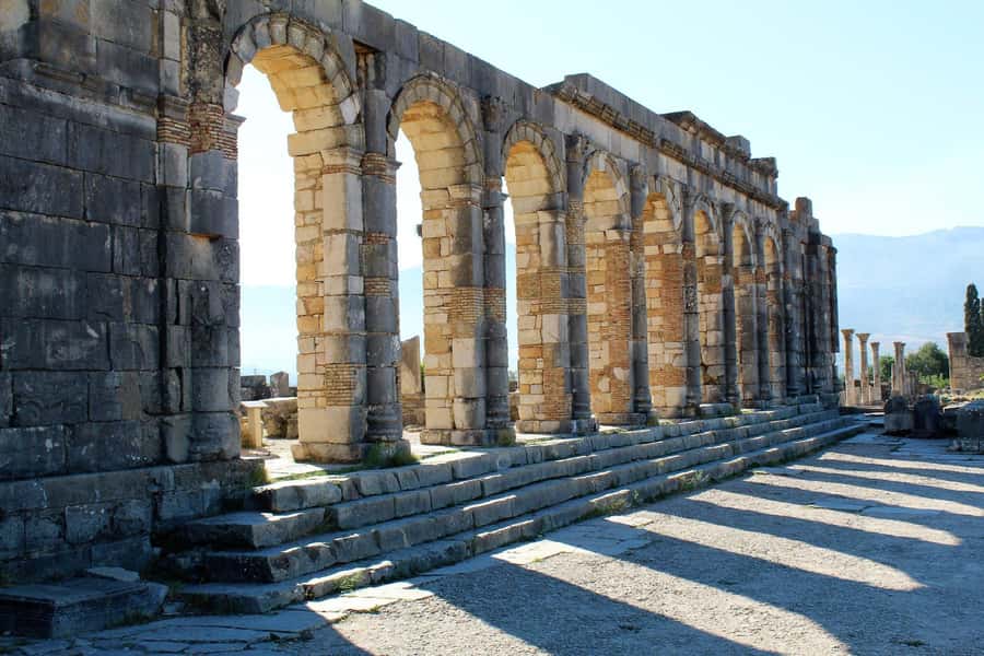 From Fez: Volubilis Moulay Idriss and Meknes Day Trip - Walking through 2,000-year-old Volubilis