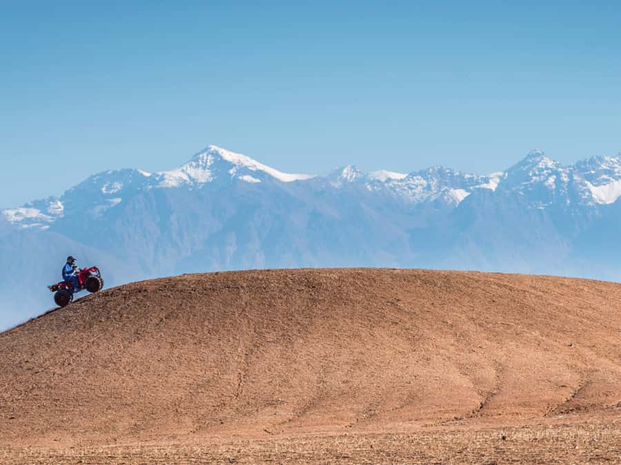 From Marrakech: Agafay Desert Sunset, Quad Biking, & Dinner - Quad biking on rocky desert tracks
