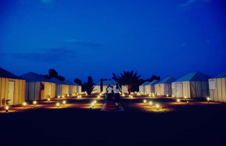 From Merzouga: Desert Overnight in Heated Tent & Camel Ride - Riding camels toward the gold dunes