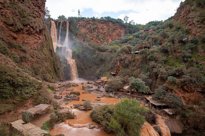Full Day Trip To Ouzoud Waterfalls From Marrakech & Boat Tour - The hand-powered boat at the foot of the falls