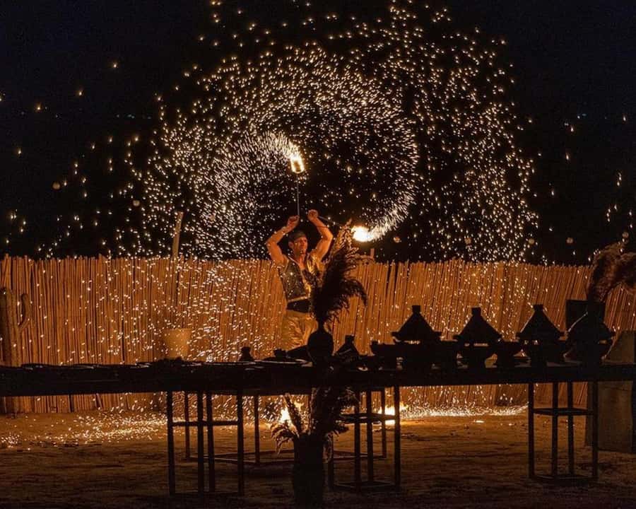 Marrakech: Agafay Desert Camel Rides, Dinner and Fire Show - Riding a camel as the sun goes down
