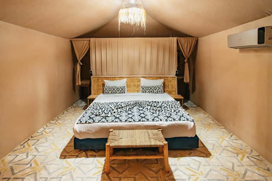 Marrakech: Agafay Desert Retreat, Tent, Dinner, Show & Pool - Sunset over a rocky desert, not a sea of sand