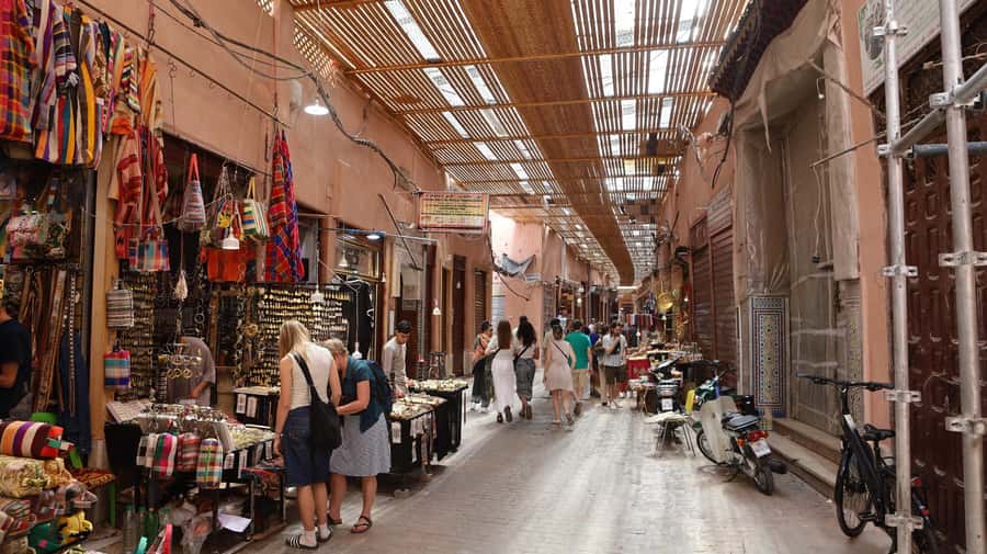 Marrakech: Ben Youssef Medersa, Le Jardin Secret & Souk Tour - Walking through the medina and its working souks