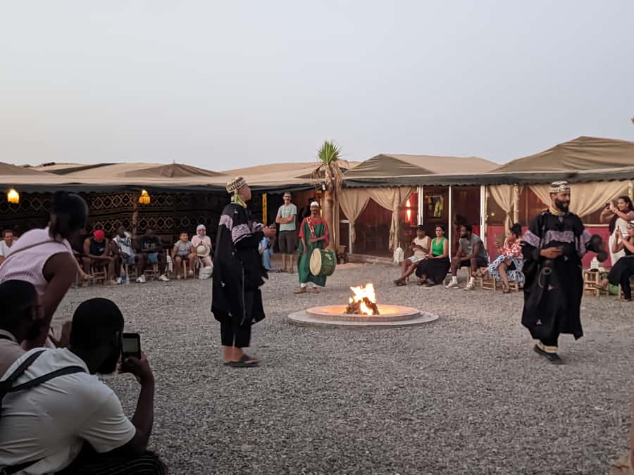 Marrakech Desert Sunset: Quad Biking, Dinner & Fire Show - Moroccan dinner under the evening sky