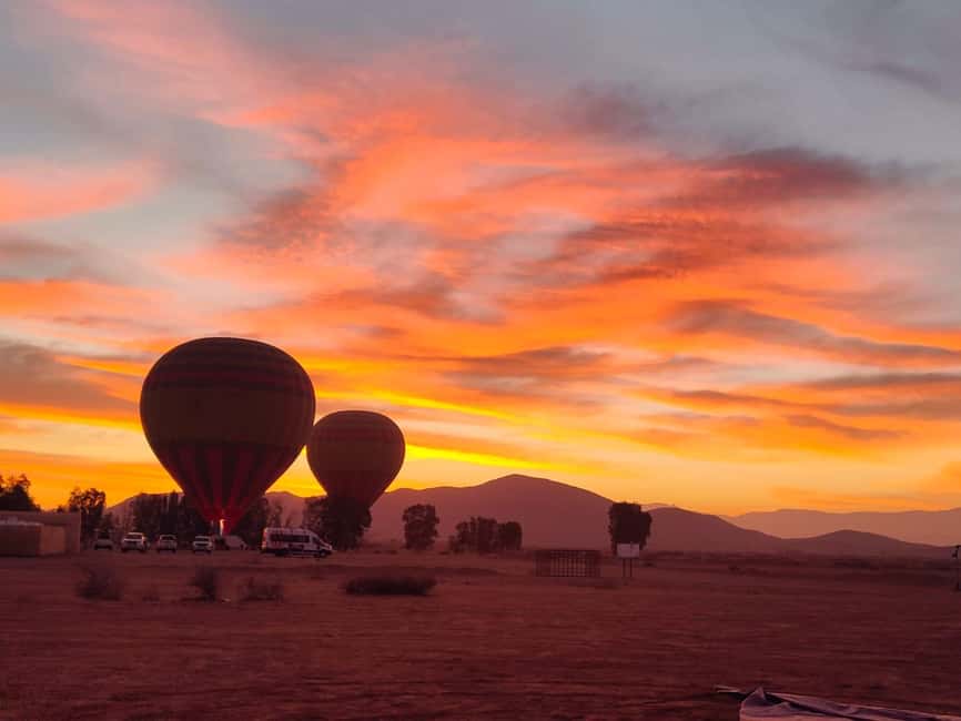 Marrakech: hot-air balloon flight with view of the Atlas Mountains and Berber breakfast - Tea, pastries, and the balloon taking shape