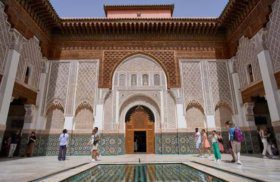 Marrakech: Madrasa Ben Youssef, Secret Garden & Medina Tour - Ben Youssef Madrasa’s carved cedar and tilework
