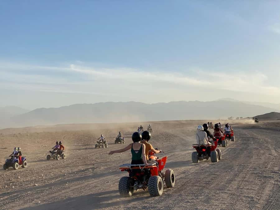 package: Agafay dinner, Sunset, show , Quad or Camel Ride - Quad biking across the stony desert