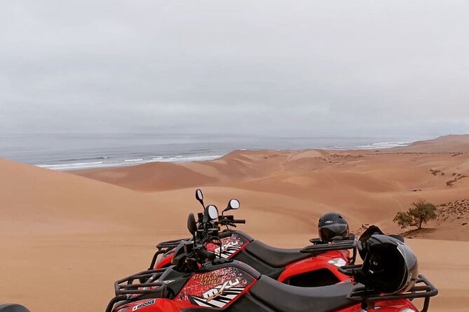 Quad Biking and Sandboarding on Sand Dunes Wild Beach - Safety instruction comes before the throttle