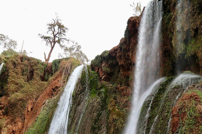 Small group Ouzoud Waterfall Guided Tour Boat Ride from Marrakech - The boat ride beneath the falling water
